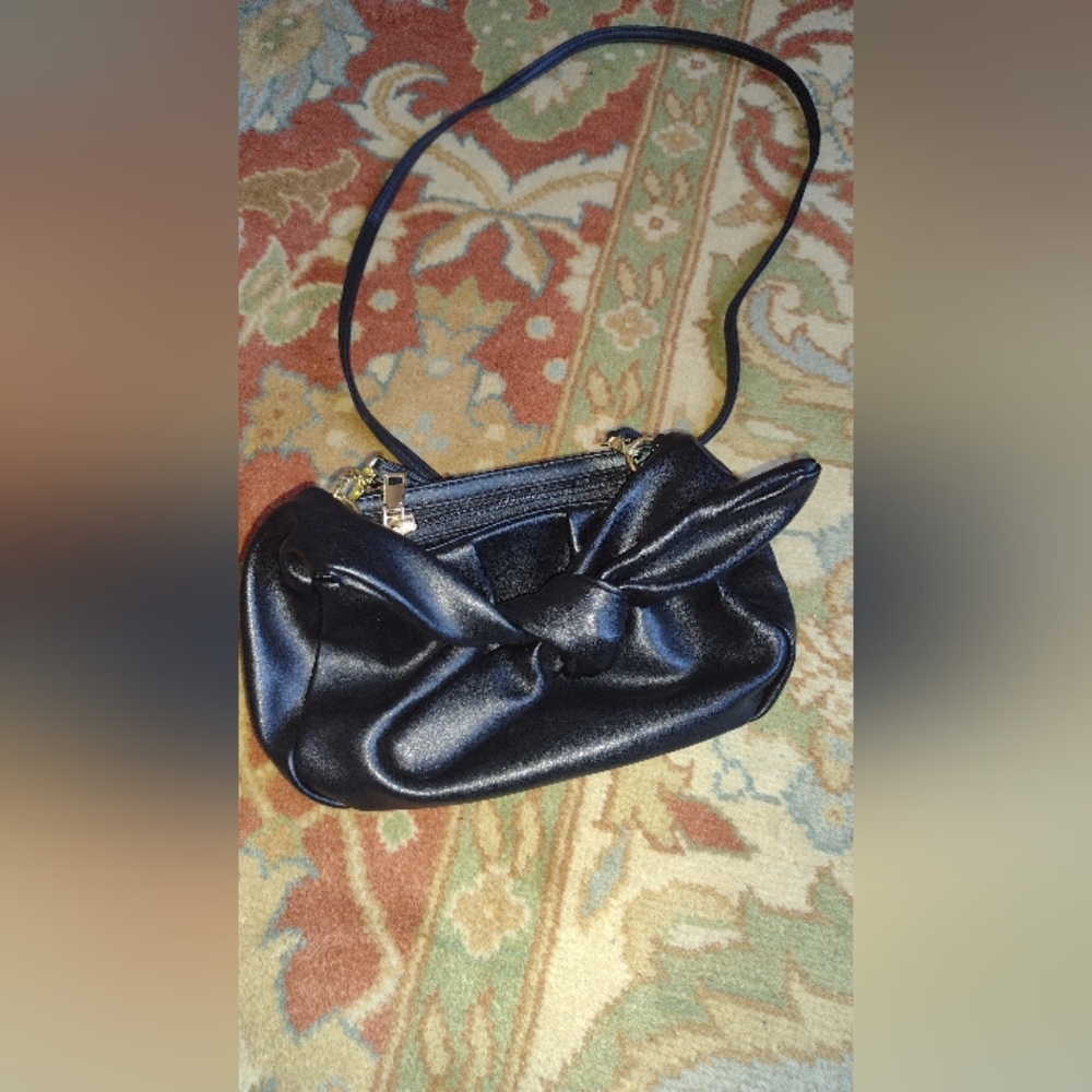 Black handbag with bow